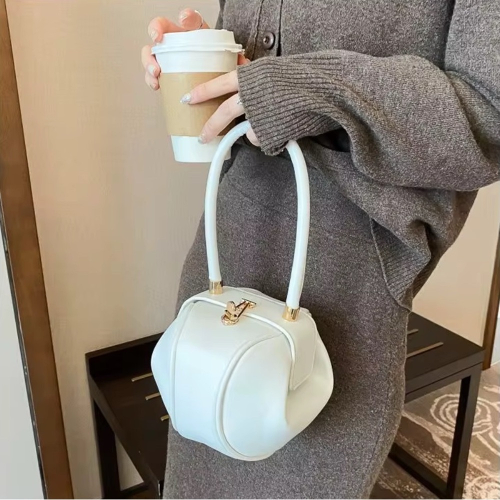 Elegant White Handbag with Gold Accents